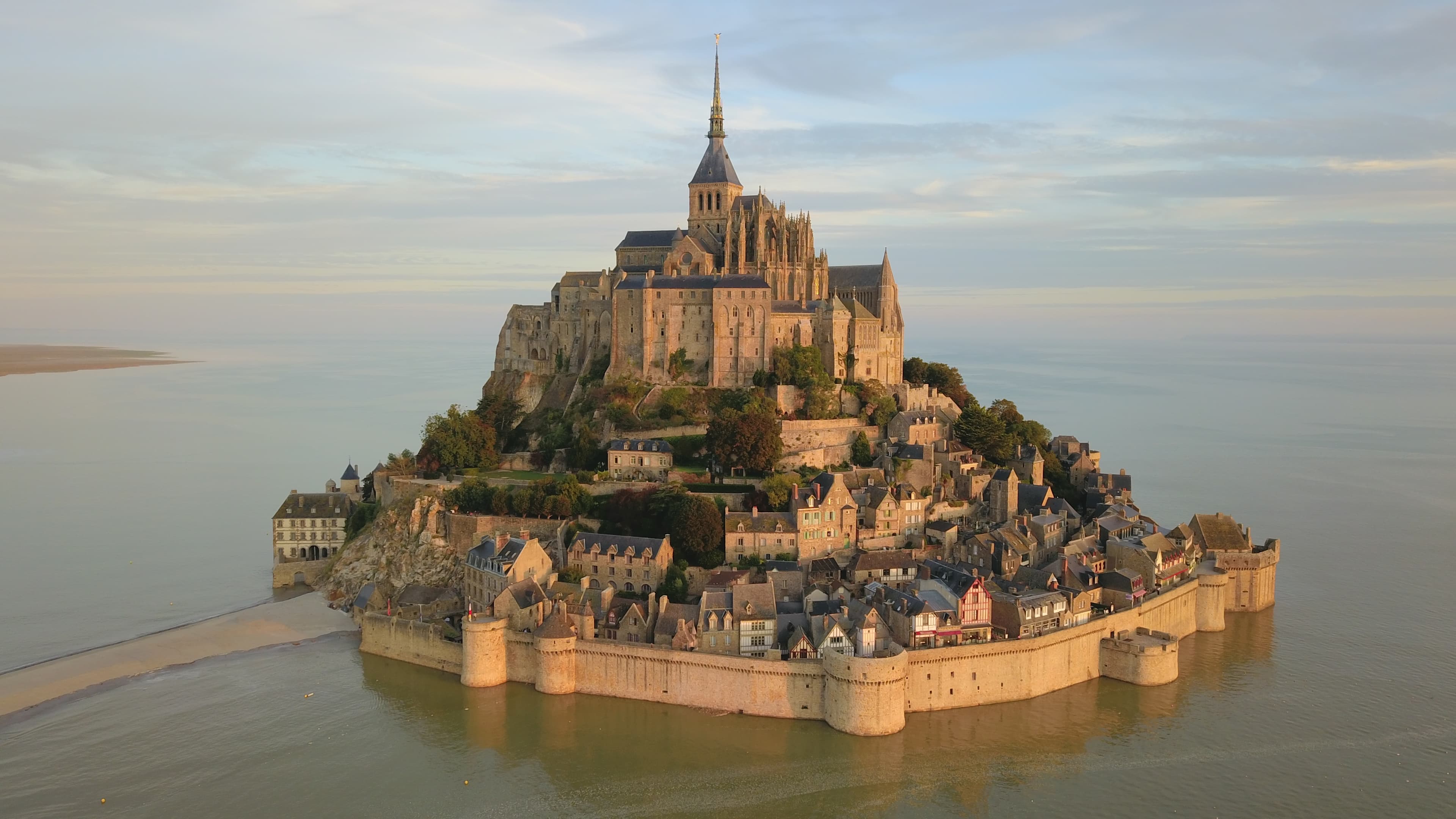 Mont-Saint-Michel rising above the bay at sunrise